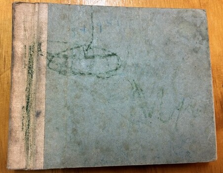 Front cover of book with some indeterminate scribble