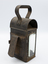Back and side view of railway lamp with handle at the top.