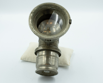 Bicycle lamp with globe prominent.