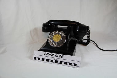 Black telephone with power cord
