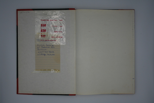Inside front cover showing plastic coin bags attached.