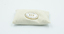 White oval badge with lettering