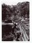 Man sitting on the edge of the Selby Trestle Bridge