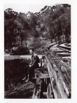 Man sitting on the edge of the Selby Trestle Bridge