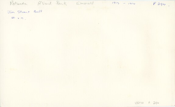 The reverse of a photograph, with handwritten annotation and an accession number in pen and pencil.