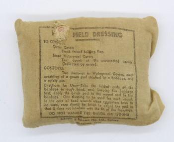 First Field Dressing, Military wound - compression bandage, OCTOBER 1942 - Manufacture: Johnson & Johnson Pty. Ltd., Sydney