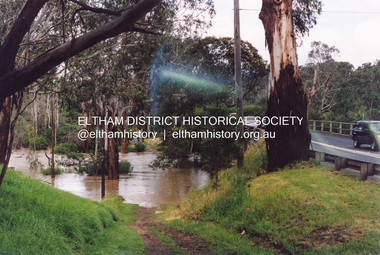 Photograph, Flooding of Diamond Creek at Lower Eltham Main Road bridge, Nov 2004, 2004