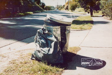 Photograph, Hazard to Garbage Collectors (Damaged bin, sharp objects in plastic bags)
