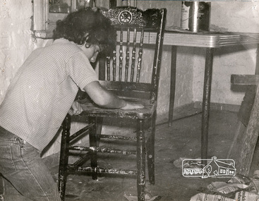 Photograph, Cleaning up furniture for use at the Eltham Living and Learning Centre, June 1974, 1974
