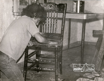 Photograph, Cleaning up furniture for use at the Eltham Living and Learning Centre, June 1974, 1974