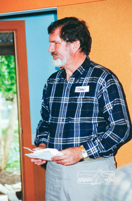 Photograph, Councillor John Graves, President, Shire of Eltham, speaking inside the Eltham Living and Learning Centre building 'Pavilion' after unveiling the centre made plaque in the forecourt, 10 October 1994, 10/10/1994