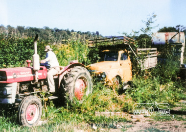 Photograph, Maurice Fabbro on tractor with truck he used to take the vegetables to the Queen Victoria Market