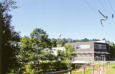Photograph, View of water tower and industrial area, Candlebark Court, Research