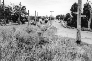 Photograph, Looking north along Main Road from Diamond Street Railway Crossing at intersection with Cecil Street, Eltham, February 1968, Feb 1968