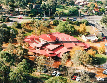 Photo album, Aerial view showing the new Eltham Library and relocated Shillinglaw Cottage, 1994, 1994