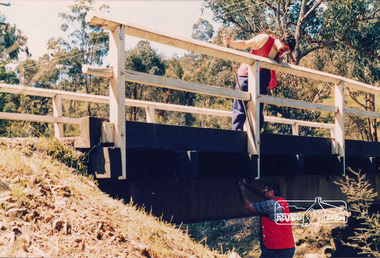 Photograph, Council workers performing maintenance works on bridge