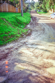 Photograph, Road surface conditions around Eltham: Looking east along Franklin Street from intersection with Bible Street, 7 Aug 1996, 1996