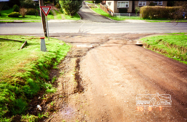 Photograph, Road surface conditions around Eltham: Looking east along John Street at the intersection with Bible Street, 7 Aug 1996, 1996