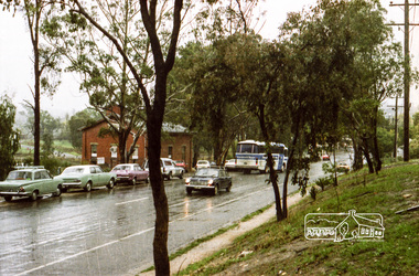 Photograph, Hurstbridge Coaches depot and Hurstbridge rail station, Heidelberg-Kinglake Road, Hurstbridge, c.1980