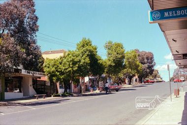 Photograph, Marjorie North, Montmorency Village Shopping Centre Looking south-southwest up from Railway Station up Were Street shops, Montmorency, 1986, 1986