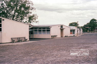 Photograph, Marjorie North, Rear view of Montmorency State Primary School looking towards Rattray Road, 8 Feb 1986, 1986