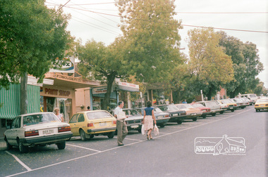 Photograph, Marjorie North, Montmorency Village Shopping Centre Looking south-southwest up from Railway Station up Were Street shops, Montmorency, 8 Feb 1986, 1986