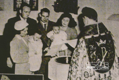 Photograph, A Baptism, conducted by the Reverend David Warren (1956-1960) wearing vestments, Vicar of St Margaret's, c.1960. The font is located in the south-east corner of the church