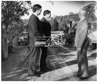 Photograph, Mr. O'Regan being shown works to be funded by Loan No. 99, 4 July 1973