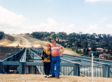 Photograph, Looking east across the new bridge construction across the Plenty River from the western side up to the new roundabout at Civic Drive; Greensborough Bypass construction, c.1986, 1986c