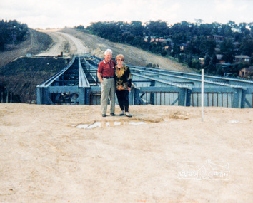 Photograph, Looking east across the new bridge construction across the Plenty River from the western side up to the new roundabout at Civic Drive; Greensborough Bypass construction, c.1986, 1986c