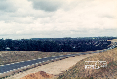 Photograph, Looking west along the newly sealed road from near the pedestrian overpass; Greensborough Bypass construction, c.1986, 1986c