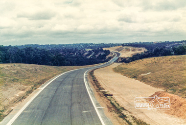 Photograph, Looking west along the newly sealed road from near the pedestrian overpass; Greensborough Bypass construction, c.1986, 1986c