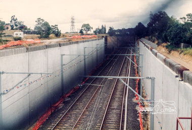 Photograph, Looking southwest from the location of the new overpass being constructed over the railway line near Watsonia Railway station; Greensborough Bypass construction, c.1986, 1986c