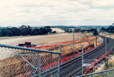 Photograph, Looking southwest from the location of the new overpass being constructed over the railway line near Watsonia Railway station; Greensborough Bypass construction, c.1986, 1986c
