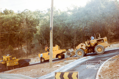 Photograph, Putting on the bitumen, road construction, Ryans Road, Eltham North, 1983