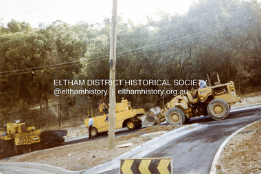 Photograph, Putting on the bitumen, road construction, Ryans Road, Eltham North, 1983, 1983
