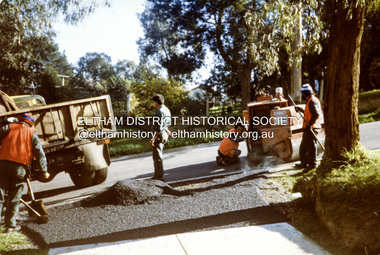 Photograph, Laying the bitumen for entrance crossing, road construction, Ryans Road, Eltham North, 1983, 1983