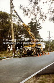 Photograph, Repairs to State Electricity Commission pole, road construction, Ryans Road, Eltham North, 1983, 1983