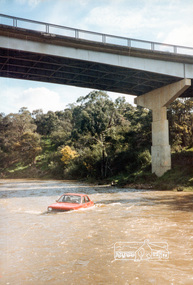 Photograph, A Holden Gemini car in the Yarra River near Westerfolds Park, Templestowe, 1985