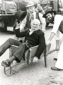 Photograph, Peter Bassett-Smith (in barrow), Joh Ebeli (at rear) and Russell Yeoman, part of the Shire of Eltham Historical Society's entry in the Eltham Community Festival Parade, 11 August 1979, 11/08/1979