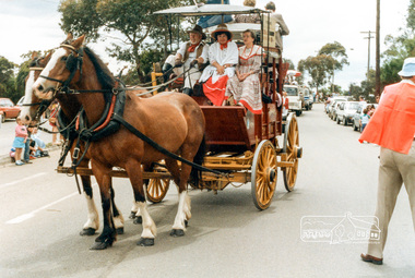 Photograph, Cobb and Co. coach driven by Ben Hall and wife (in centre), Eltham Community Festival Parade, 8 November 1986, 08/11/1986