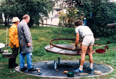 Photograph, Installation of the Tyring Plate, the main feature of the Shire of Eltham Historical Society's Victorian 150th Anniversary Monument, c. November 1985, 1985