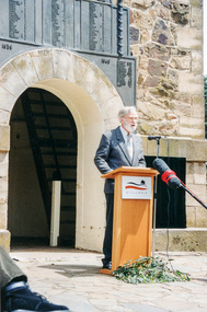 Photograph, Harry Gilham presents a history of the site, Rededication Ceremony, War Memorial Tower, Kangaroo Ground. 8 November 2001, 08/11/2001