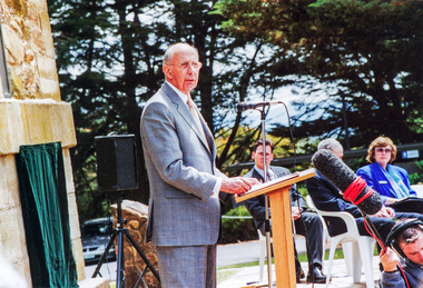 Photograph, Christine Delaney, Nillumbik Shire Council, John Landy, AC, CVO, MBE, Governor of Victoria, addresses guests, Rededication Ceremony, War Memorial Tower, Kangaroo Ground. 8 November 2001, 08/11/2001