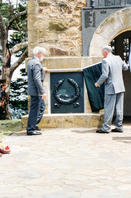 Photograph, Governor Landy with assistance from Harry Gilham unveils the Korea-Borneo plaque, Rededication Ceremony, War Memorial Tower, Kangaroo Ground, 08 November 2011