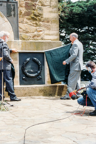 Photograph, Governor Landy with assistance from Harry Gilham unveils the Malaya-Vietnam plaque, Rededication Ceremony, War Memorial Tower, Kangaroo Ground, 08/11/2001