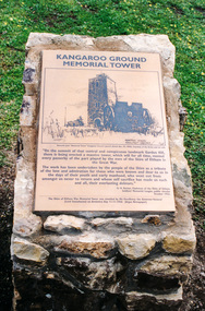 Photograph, The etched brass plate of Kenneth Jack's 1943 sketch and the 1926 public notice of the Tower's 'purpose' to the forces of the Great War from the Shire of Eltham