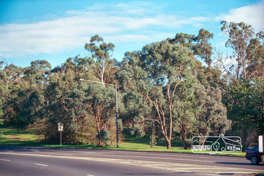 Photograph, Looking west to reserve bounded by Main Road, Bolton Street and Fitzsimons Lane from Fitzsimons Lane roundabout, Eltham, c.May 2001