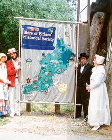 Photograph, Russell Yeoman (left) and Joh Ebeli hold the Society Banner at the end of the Parade in Panther Place near the Railway Trestle Bridge, Eltham Community Festival Parade, 8 November 1986, 08/11/1986
