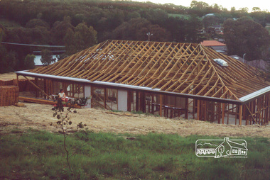 Photograph, Carla Vermey in backyard, roof not yet tiled